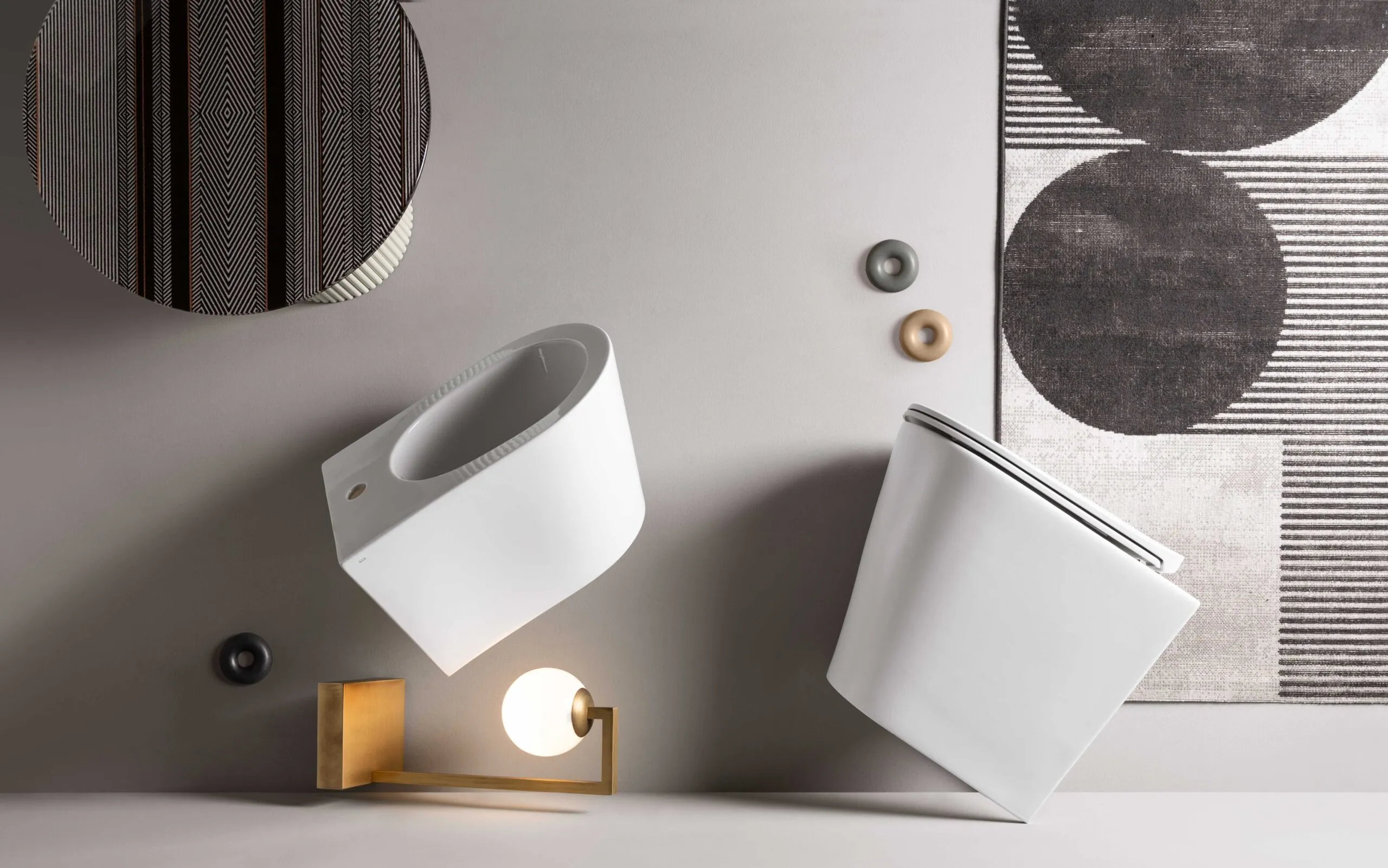 Sculptural white basins with wall-mounted fittings in a neutral interior